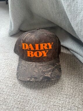 Dairy Boy Orange Logo Camouflage Baseball Cap